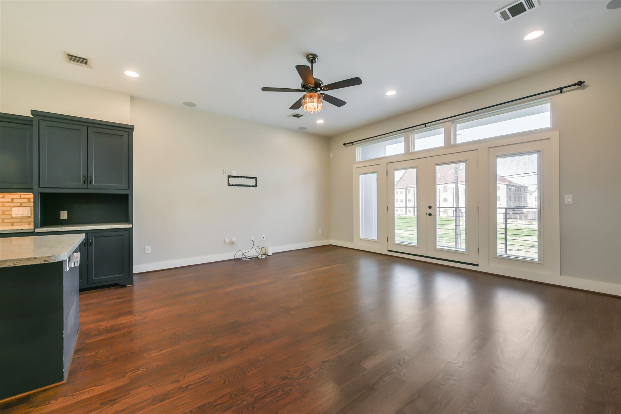 2422 Hadley Street Houston, TX 77004 - Photo 22 of 50 a view of an empty room with wooden floor and a window