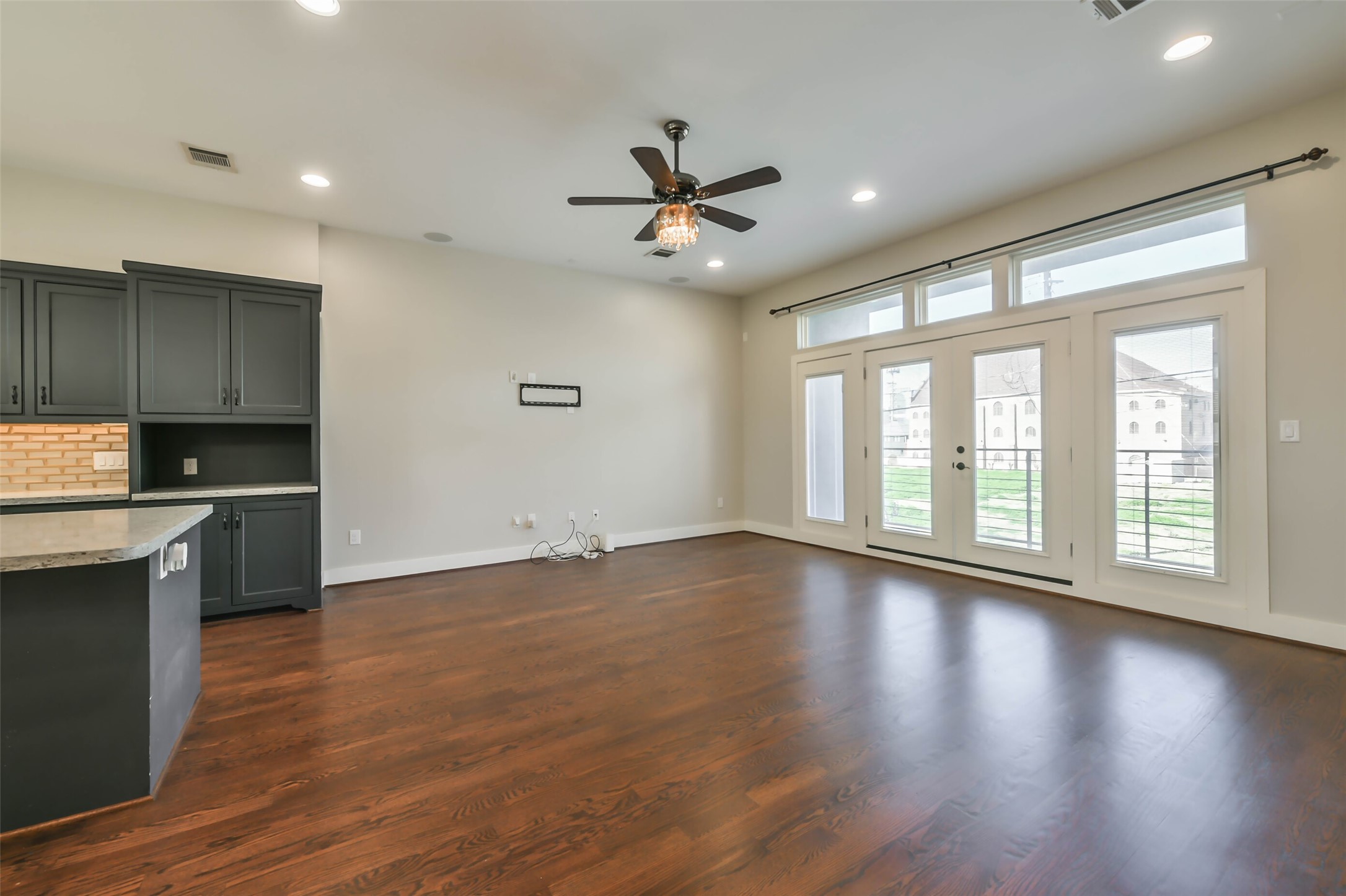 2422 Hadley Street Houston, TX 77004 - Photo 25 of 50 a view of an empty room with window and wooden floor