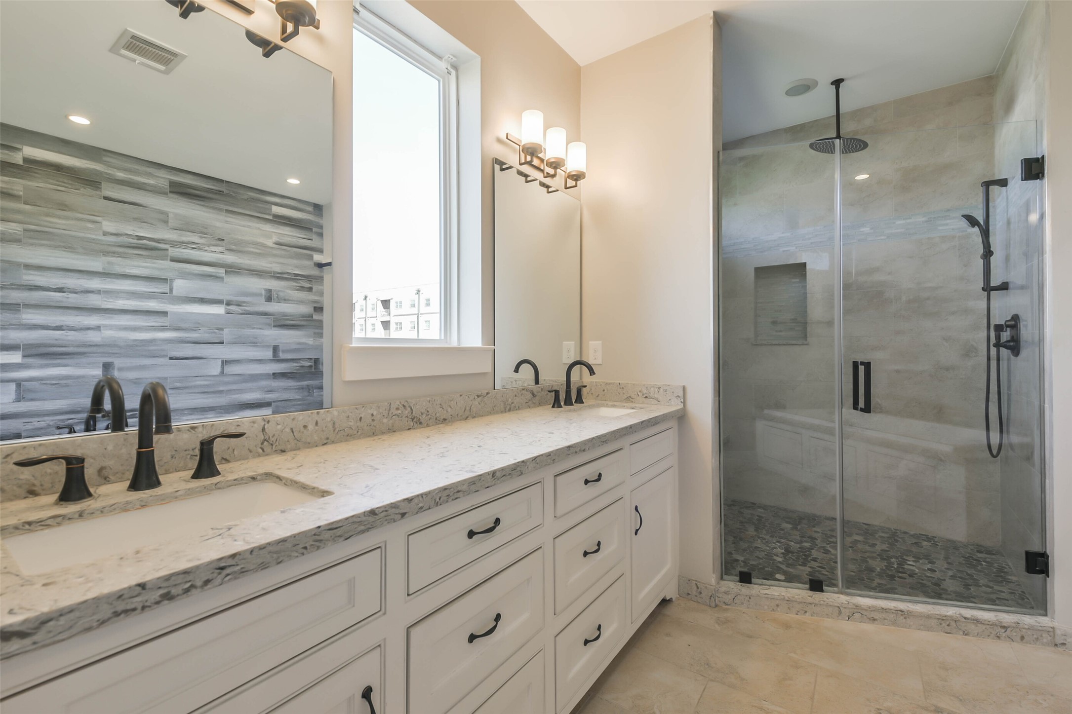 2422 Hadley Street Houston, TX 77004 - Photo 36 of 50 a bathroom with a granite countertop sink mirror and shower