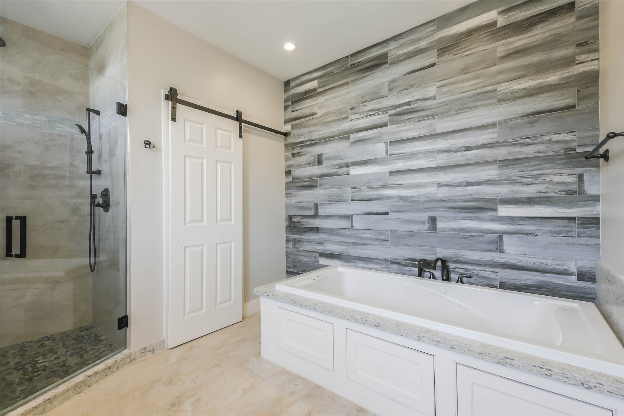 2422 Hadley Street Houston, TX 77004 - Photo 37 of 50 a bathroom with a bathtub and a shower