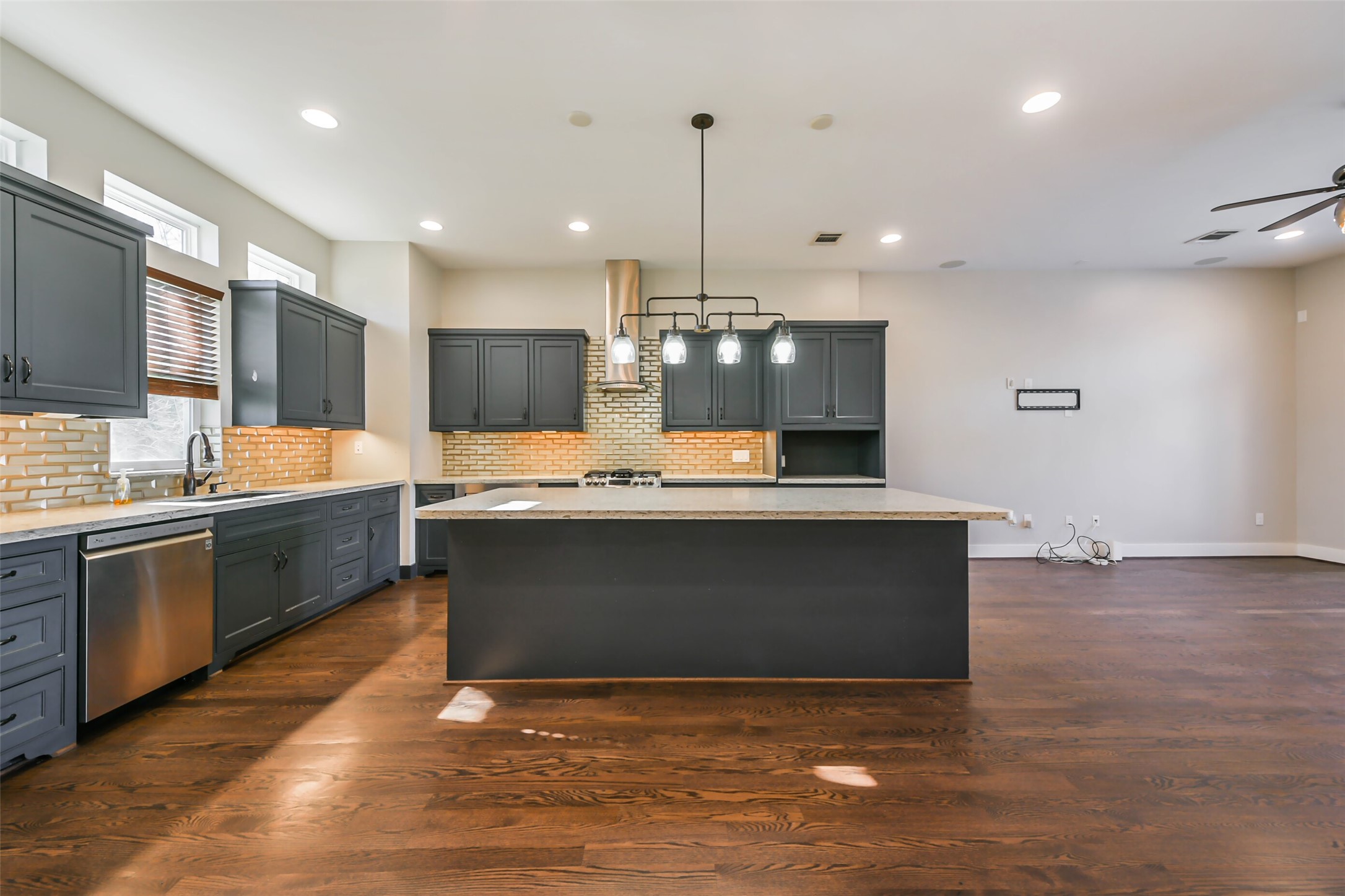 2422 Hadley Street Houston, TX 77004 - Photo 10 of 50 a large kitchen with granite countertop a large counter top a sink stainless steel appliances and cabinets