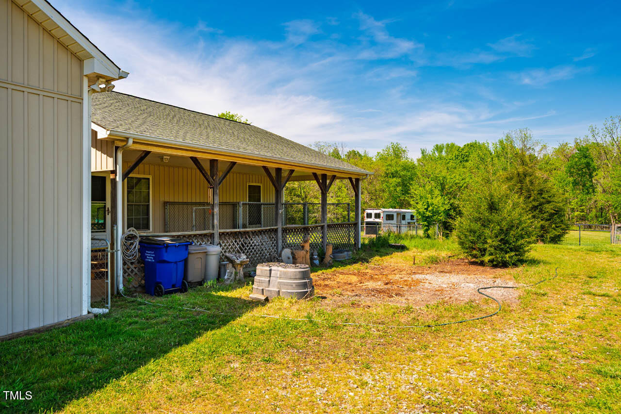 5916-5918 Laws Farm Road Rougemont, NC 27572 - Photo 52 of 69 a view of a house with a backyard