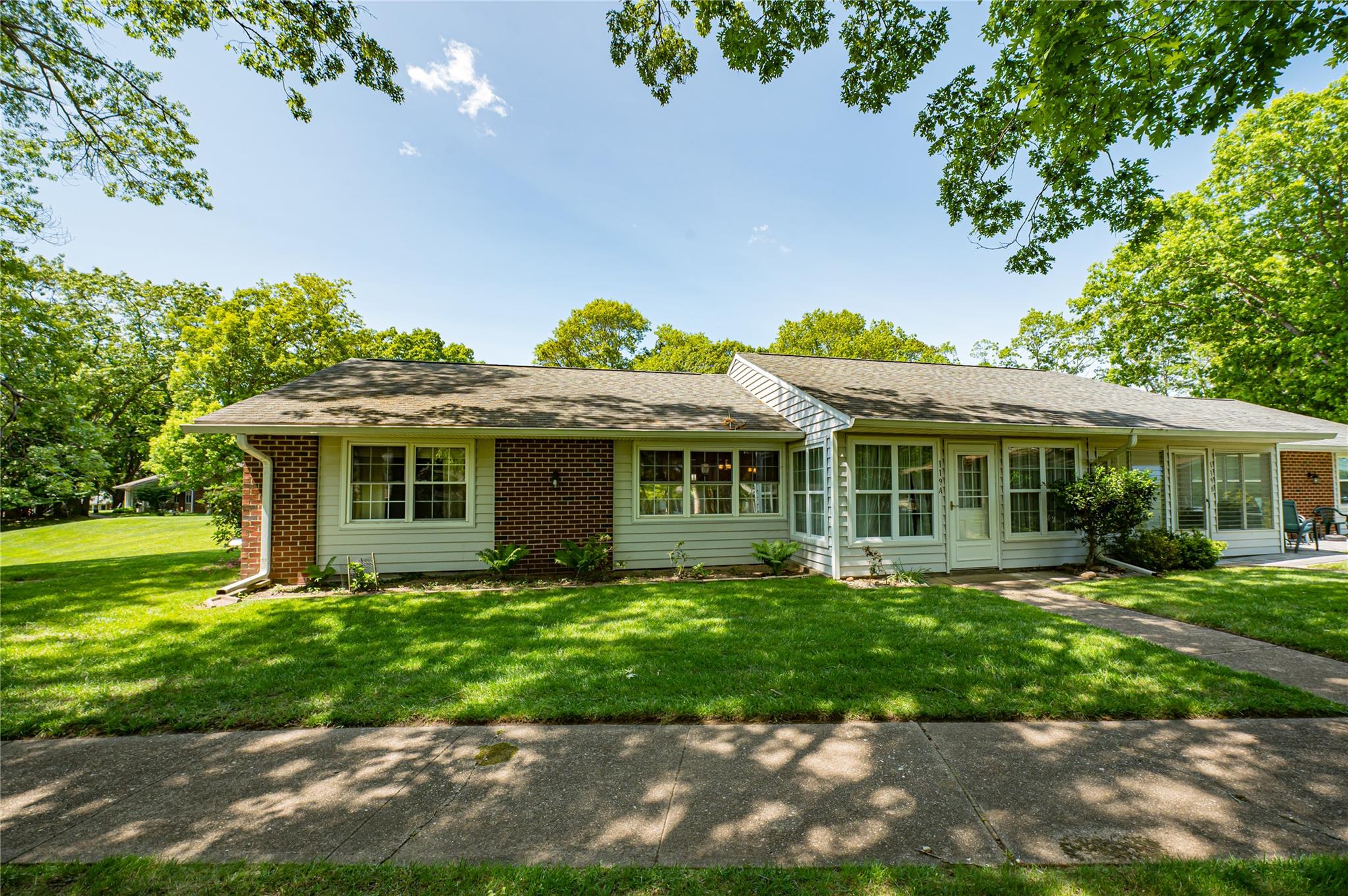 119 Exmore Court, Unit A Ridge, NY 11961 - Photo 1 of 1 Single story home with a front lawn, brick siding, and a shingled roof