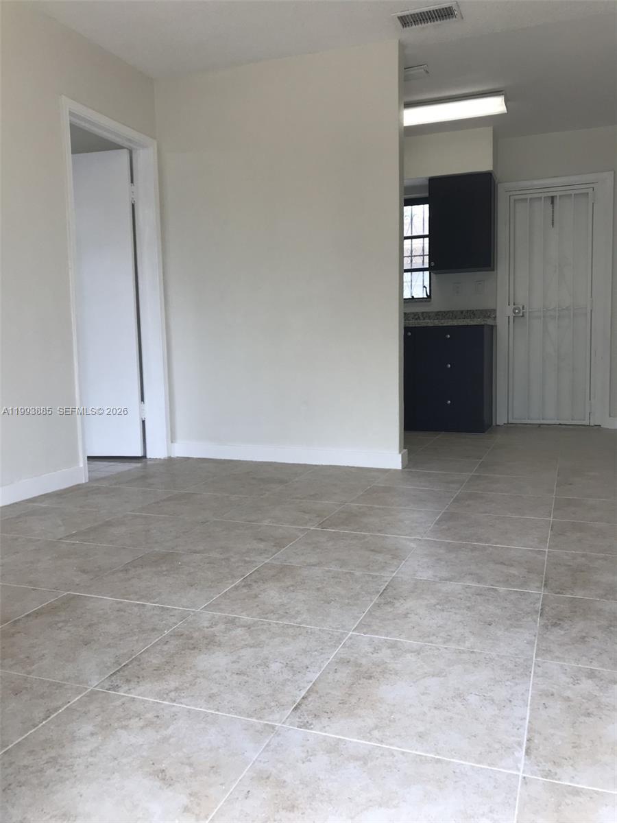 2362 Northwest 34th Street, Unit 2 Miami, FL 33142 - Photo 3 of 8 a view of wooden floor