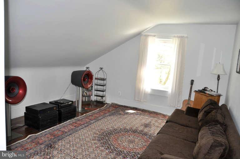 1708 Mansion Ridge Road Annapolis, MD 21401 - Photo 27 of 30 a living room with furniture a window and a wooden floor