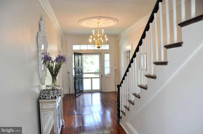 1708 Mansion Ridge Road Annapolis, MD 21401 - Photo 7 of 30 a view of entryway with wooden floor and a chandelier