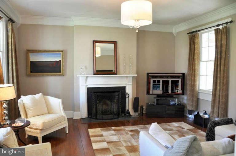 1708 Mansion Ridge Road Annapolis, MD 21401 - Photo 8 of 30 a living room with furniture a fireplace and a flat screen tv