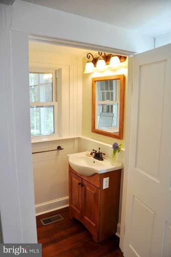 1708 Mansion Ridge Road Annapolis, MD 21401 - Photo 9 of 30 a bathroom with a sink and a window