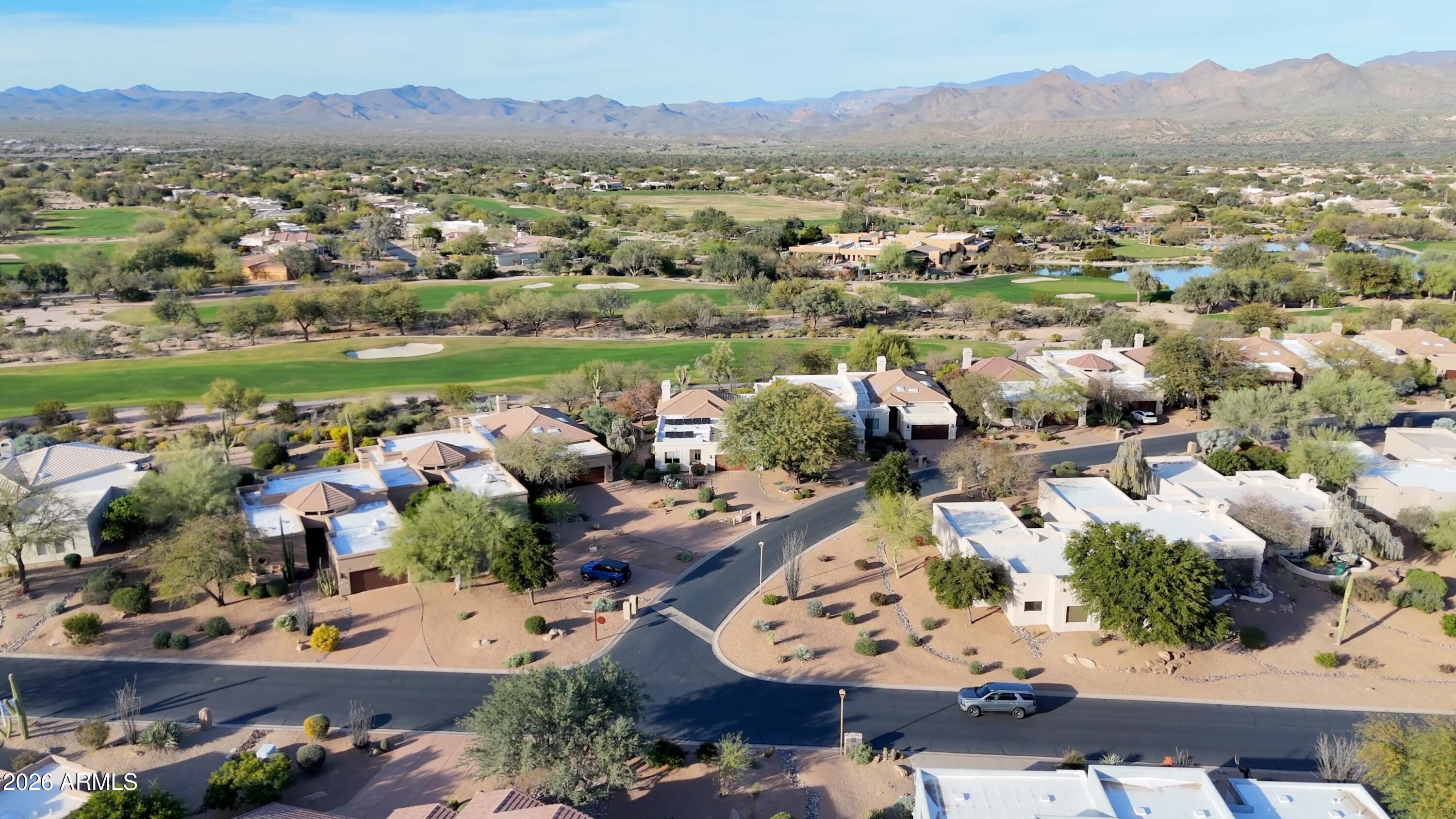 18602 Amarado Circle Rio Verde, AZ 85263 - Photo 42 of 58 an aerial view of a city with lots of residential buildings and mountain view in back