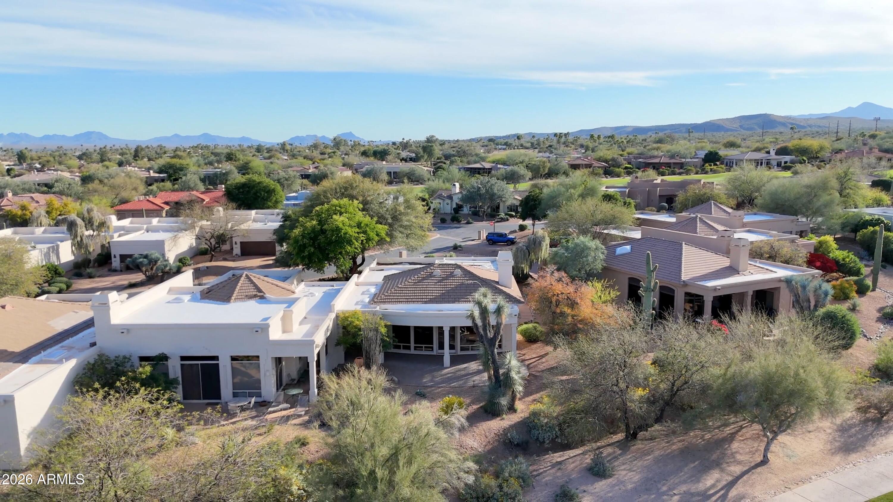 18602 Amarado Circle Rio Verde, AZ 85263 - Photo 45 of 58 an aerial view of a house with a yard and lake view