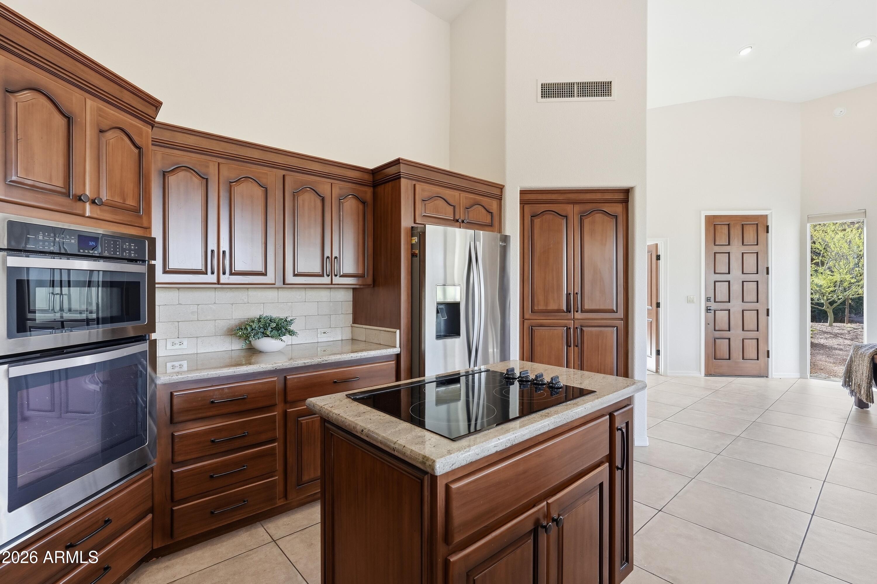 18602 Amarado Circle Rio Verde, AZ 85263 - Photo 8 of 58 a kitchen that has a sink cabinets and stainless steel appliances