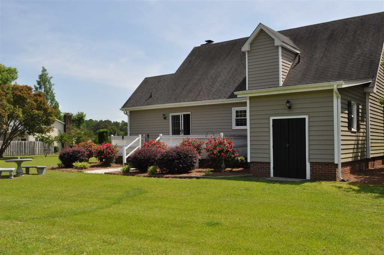 5616 Cleveland Road Clayton, NC 27520 - Photo 20 of 21 Large attached storage area and nice landscaping.