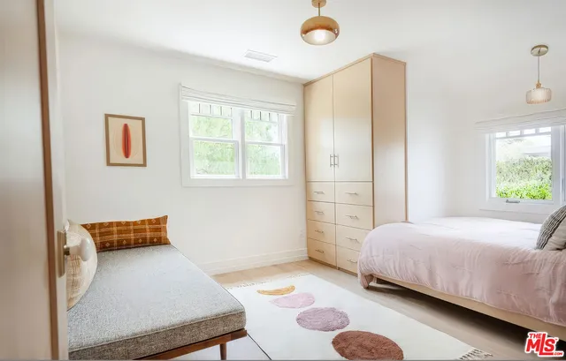 a bedroom with a bed and furniture