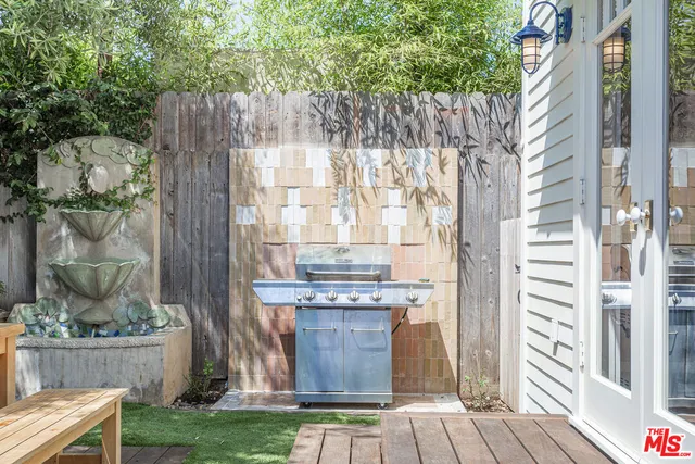 a front view of a house with patio furniture