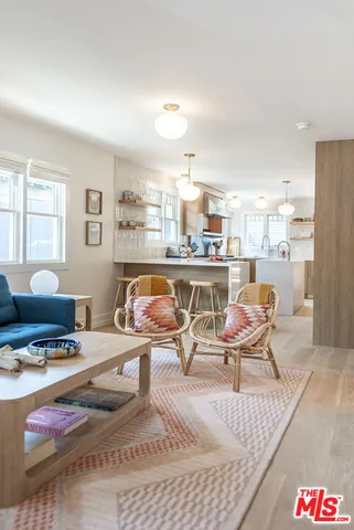 a living room with furniture and a table