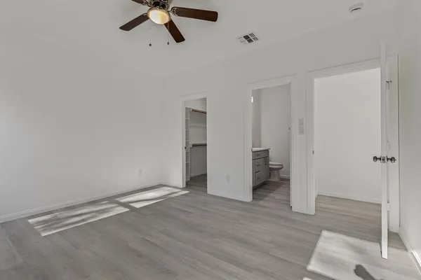 a kitchen with stainless steel appliances granite countertop a sink a stove and a microwave