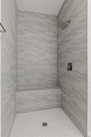 a bathroom with a granite countertop sink a toilet and a mirror