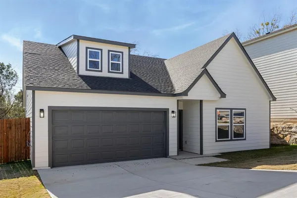 a front view of a house with a garage