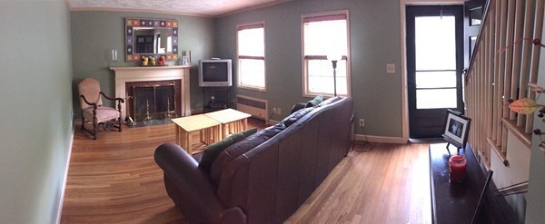 20 Blackman Road Canton, MA 02021 - Photo 4 of 8 a living room with furniture fireplace and flat screen tv
