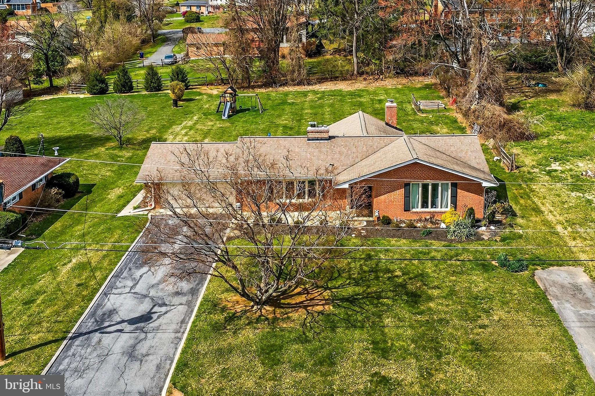 7416 Downhill Run Frederick, MD 21702 - Photo 12 of 74 a aerial view of a house with a yard