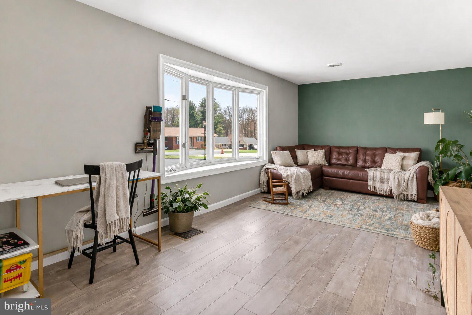 7416 Downhill Run Frederick, MD 21702 - Photo 20 of 74 a living room with furniture and a large window