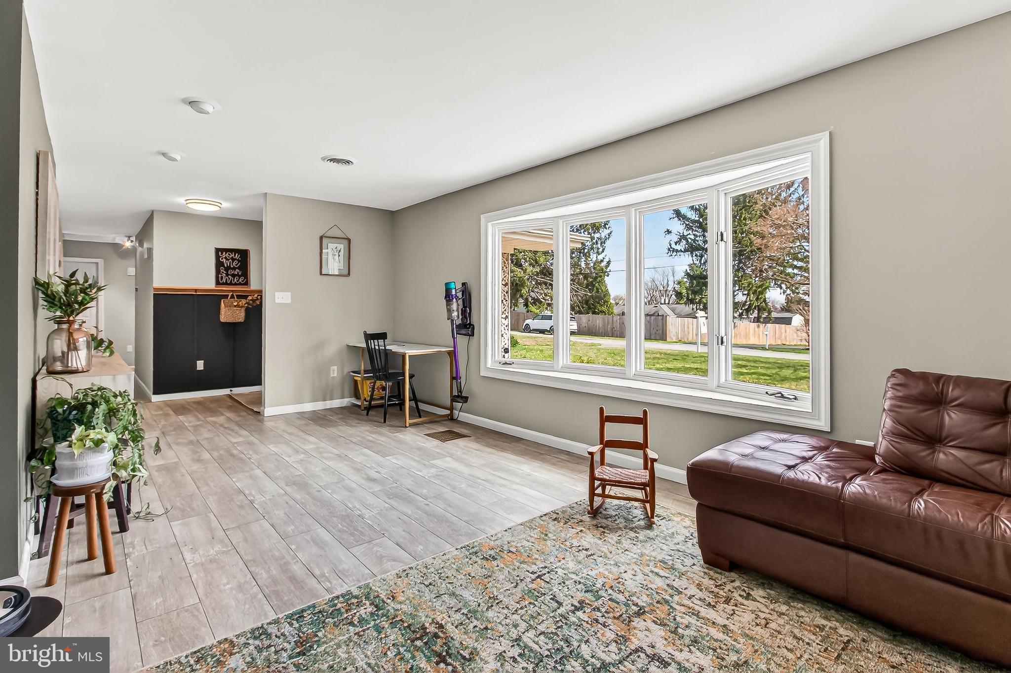 7416 Downhill Run Frederick, MD 21702 - Photo 23 of 74 a living room with furniture and a large window