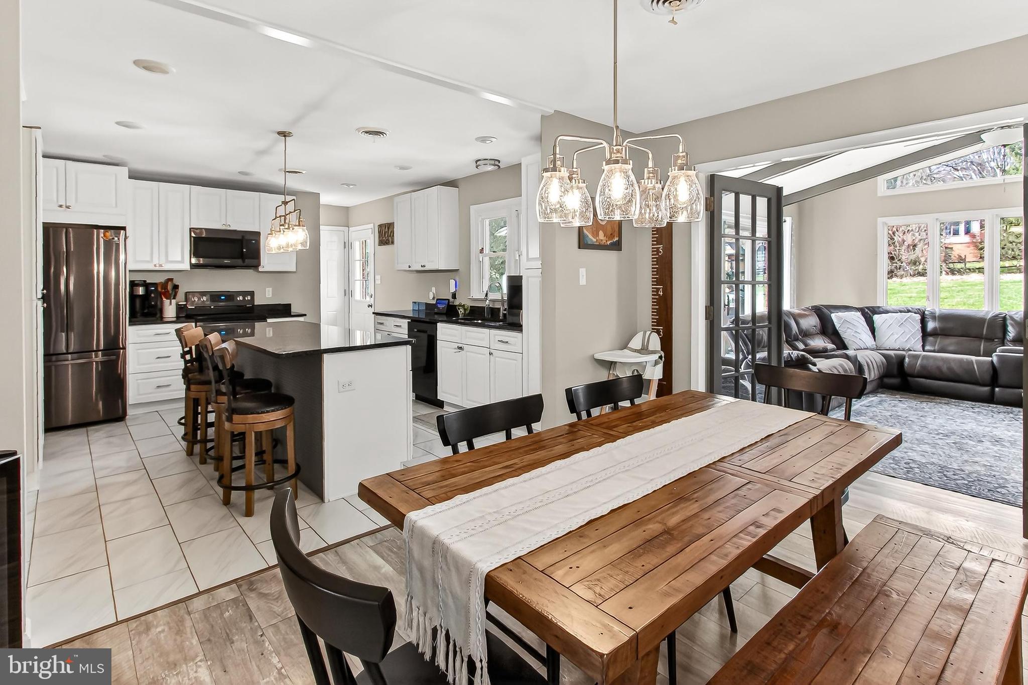 7416 Downhill Run Frederick, MD 21702 - Photo 26 of 74 a large kitchen with a table and chairs