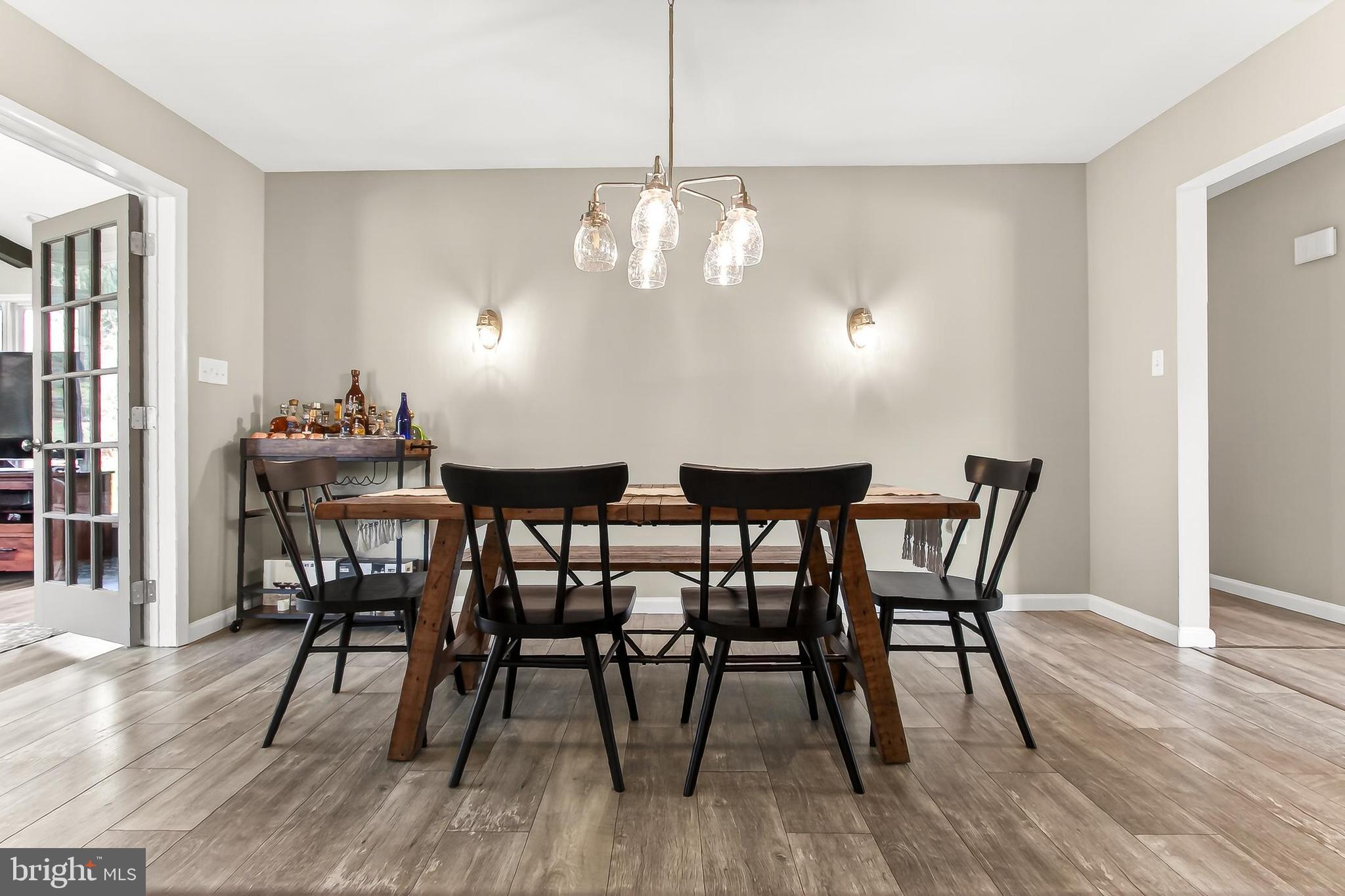 7416 Downhill Run Frederick, MD 21702 - Photo 27 of 74 a view of a dining room with furniture and wooden floor
