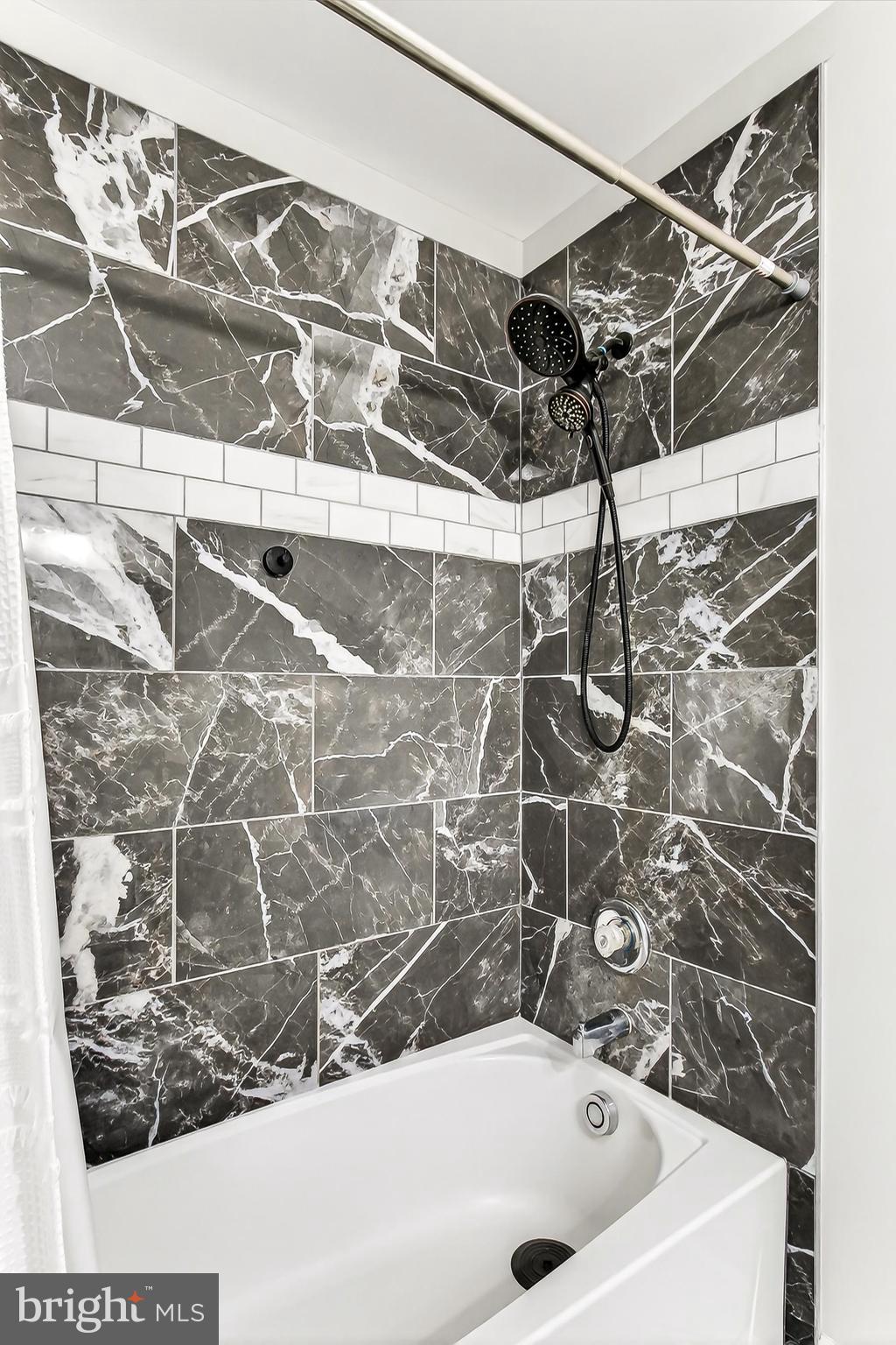 7416 Downhill Run Frederick, MD 21702 - Photo 46 of 74 a bathroom with a bathtub and shower