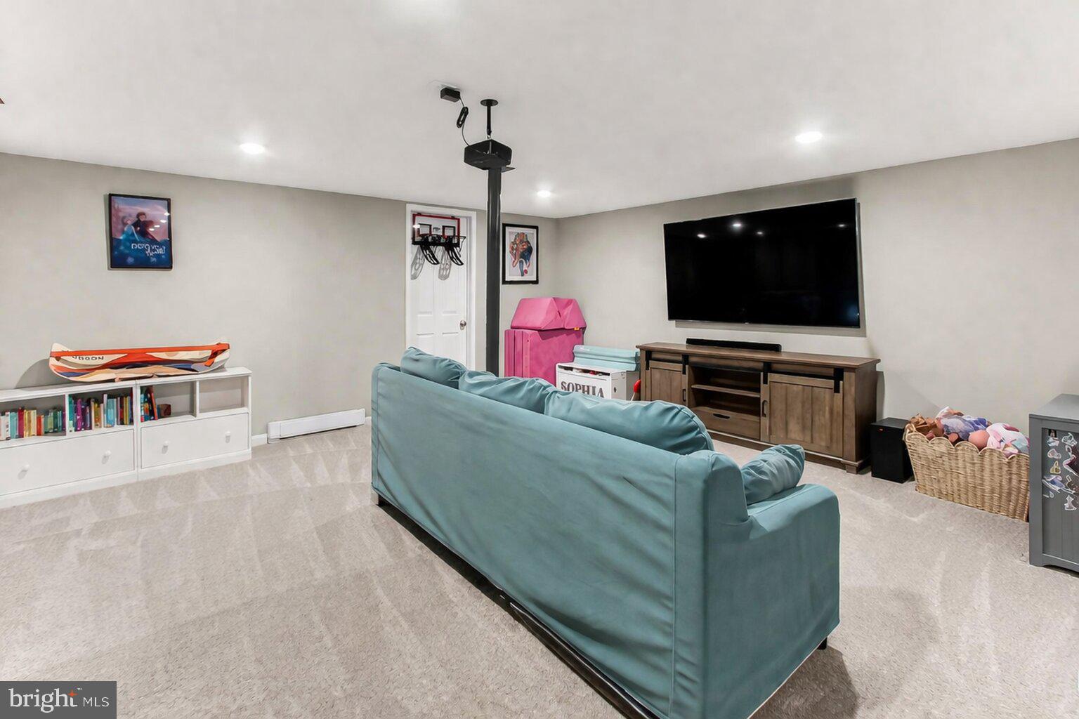 7416 Downhill Run Frederick, MD 21702 - Photo 54 of 74 a living room with furniture and a flat screen tv