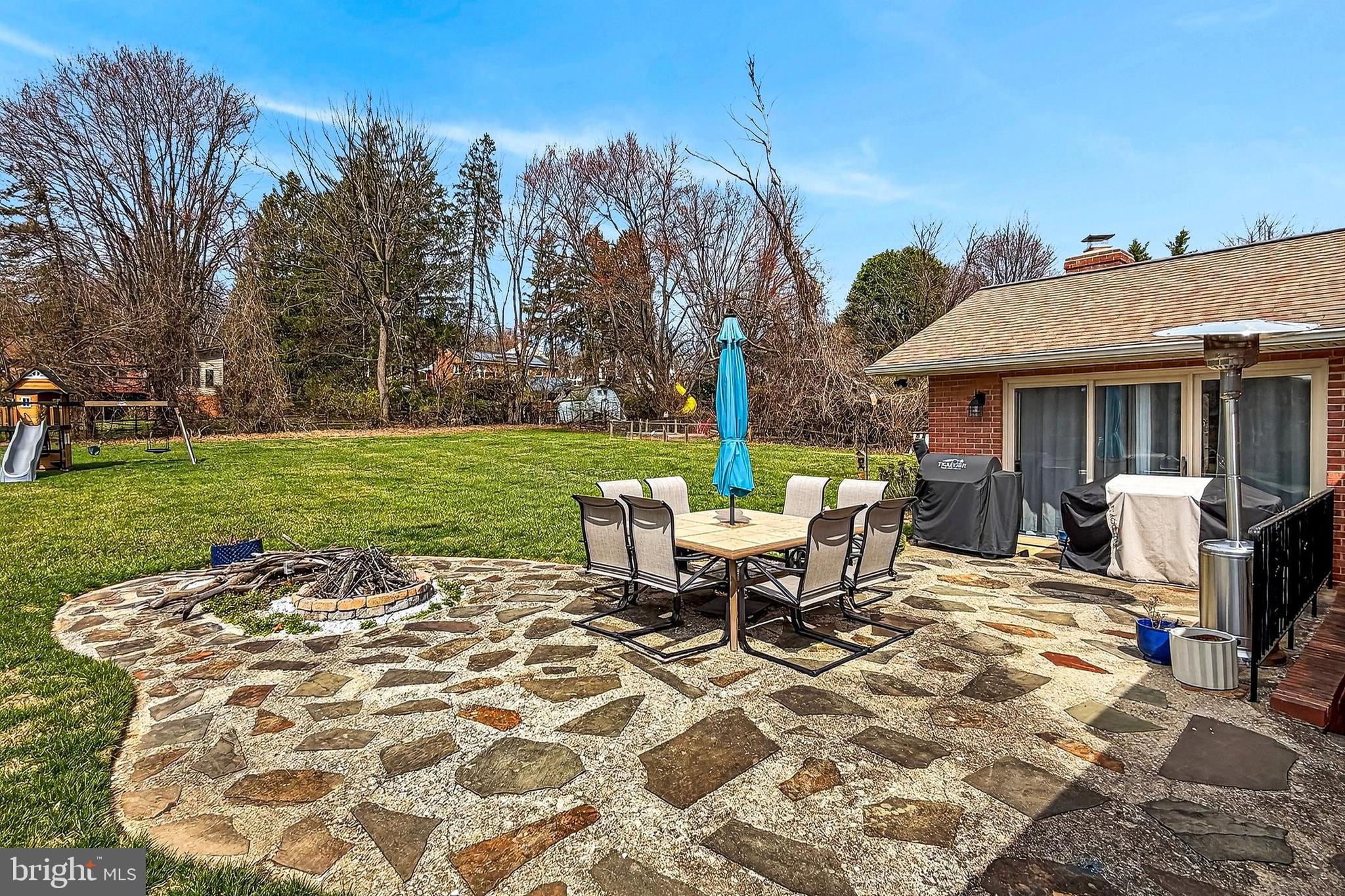 7416 Downhill Run Frederick, MD 21702 - Photo 64 of 74 a view of a patio with table and chairs near a yard