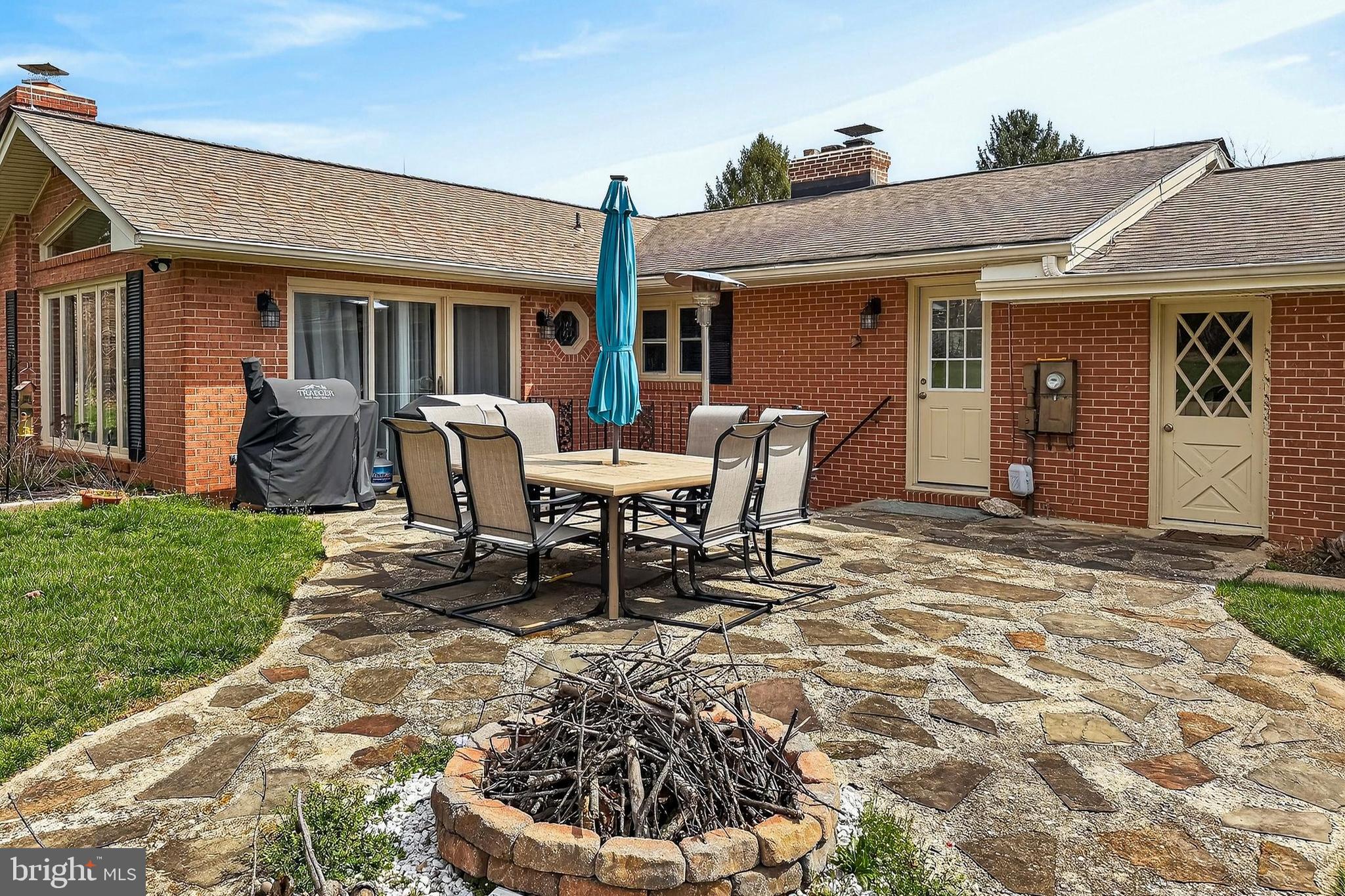 7416 Downhill Run Frederick, MD 21702 - Photo 65 of 74 a view of a house with backyard sitting area and garden