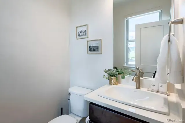 a bedroom with a rug and a white wall