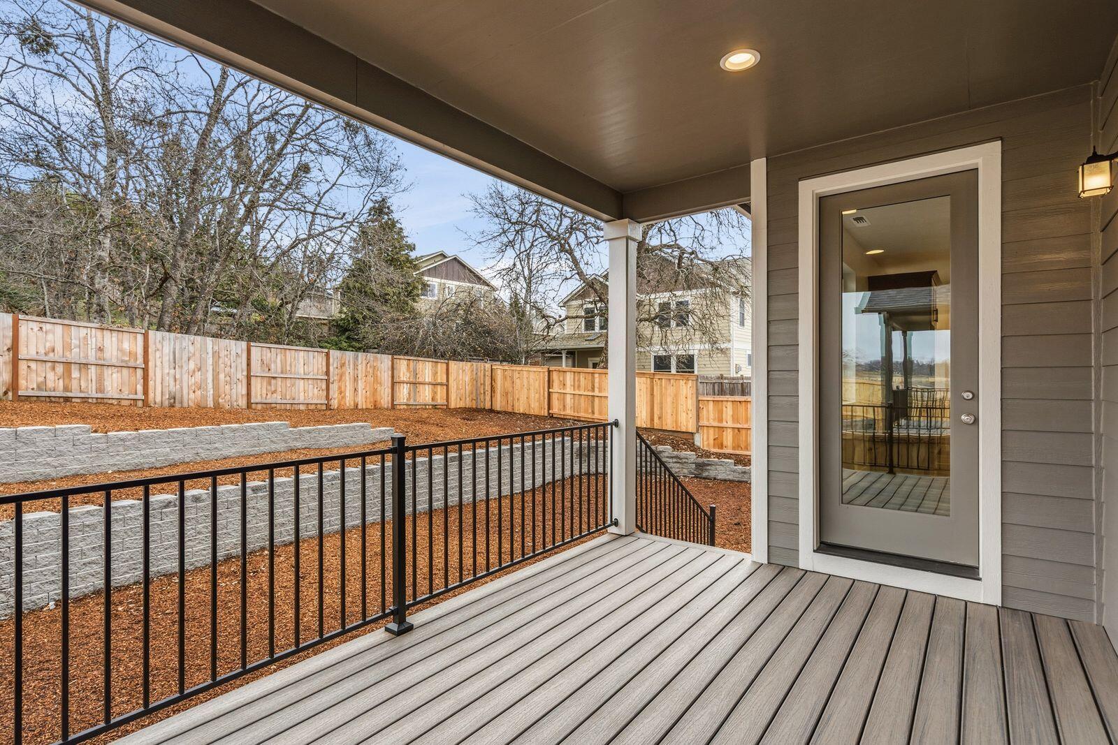 669 Old Waverly Way, Unit 20 Eagle Point, OR 97524 - Photo 27 of 32 a view of a porch with wooden floor and floor to ceiling window