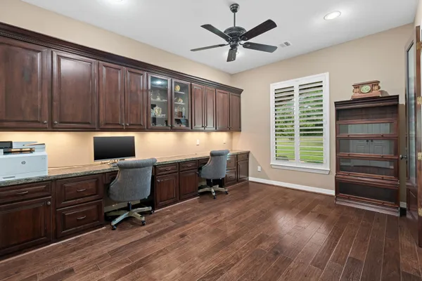 a work room with furniture and windows