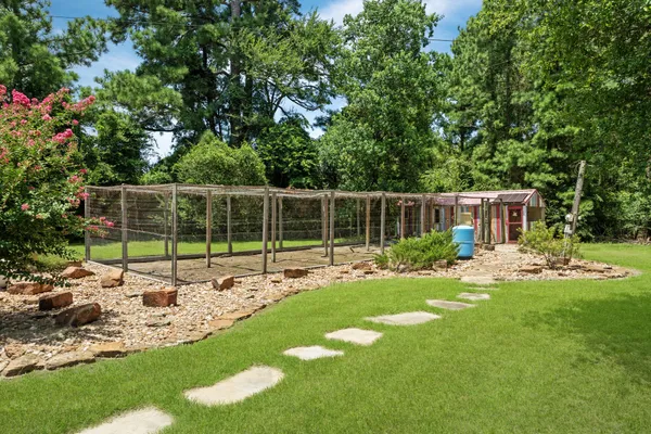 a view of an house with backyard space and balcony