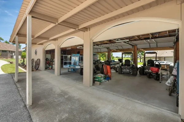a view of a garage with cars