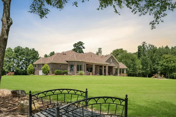 a view of a house with garden and deck