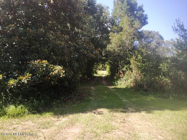 4155 Pinto Road Middleburg, FL 32068 - Photo 18 of 38 a view of a lake from a yard