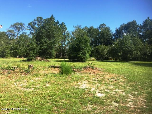 4155 Pinto Road Middleburg, FL 32068 - Photo 25 of 38 a view of a golf course with a lake