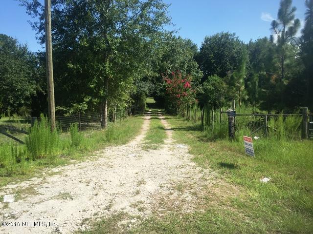 4155 Pinto Road Middleburg, FL 32068 - Photo 34 of 38 a view of a lake view with a large trees