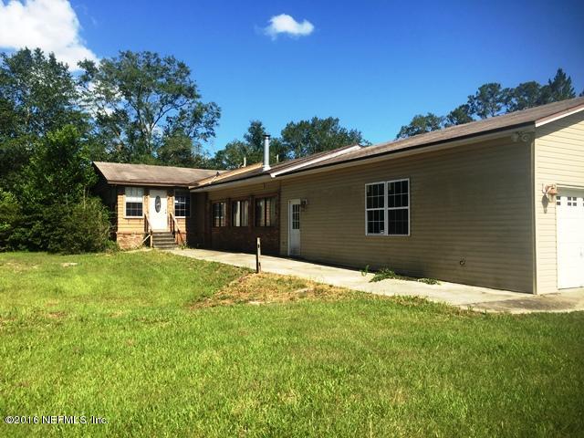 4155 Pinto Road Middleburg, FL 32068 - Photo 36 of 38 a backyard of a house with lots of green space and outdoor space