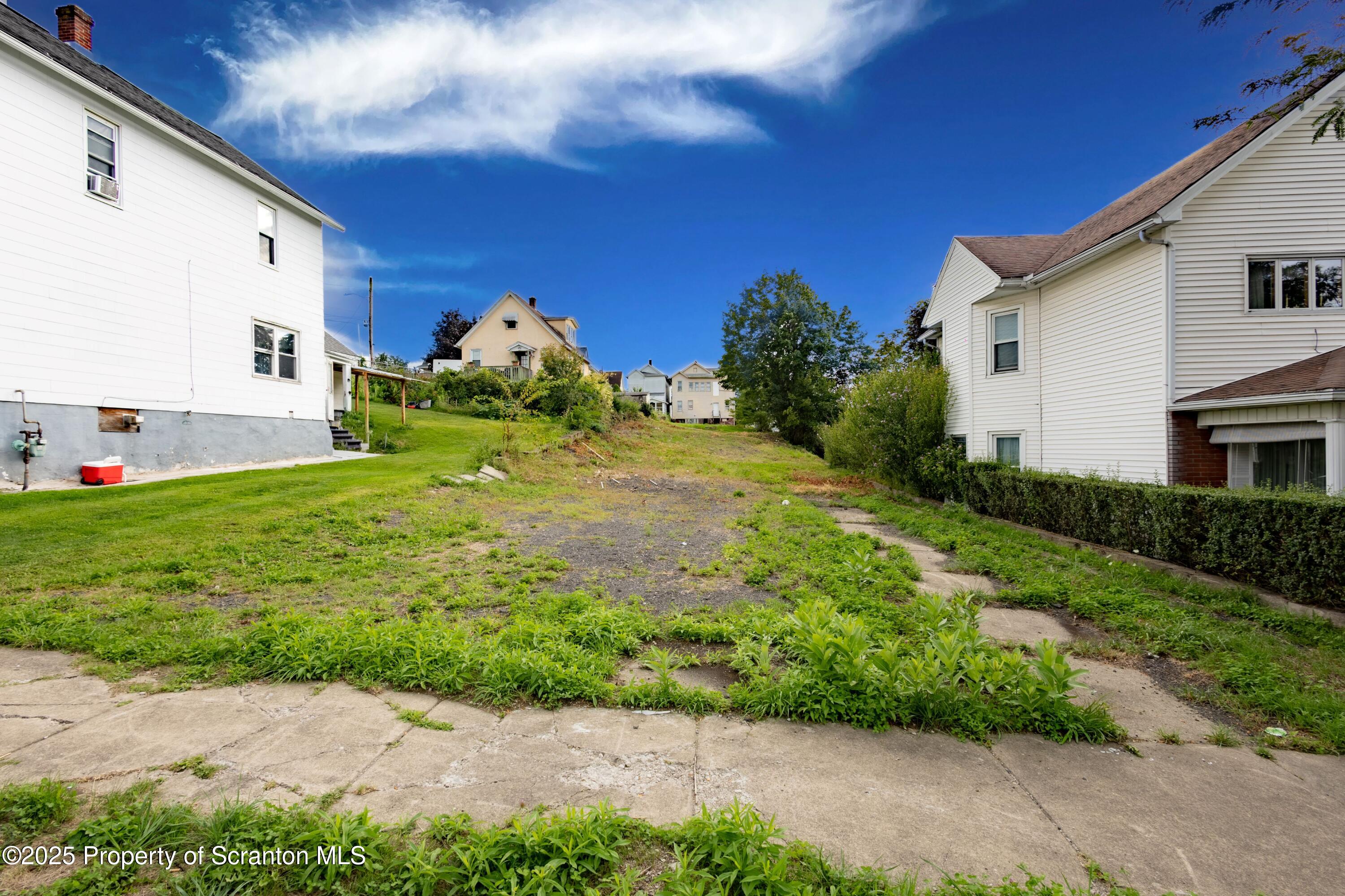 a view of a back yard of the house