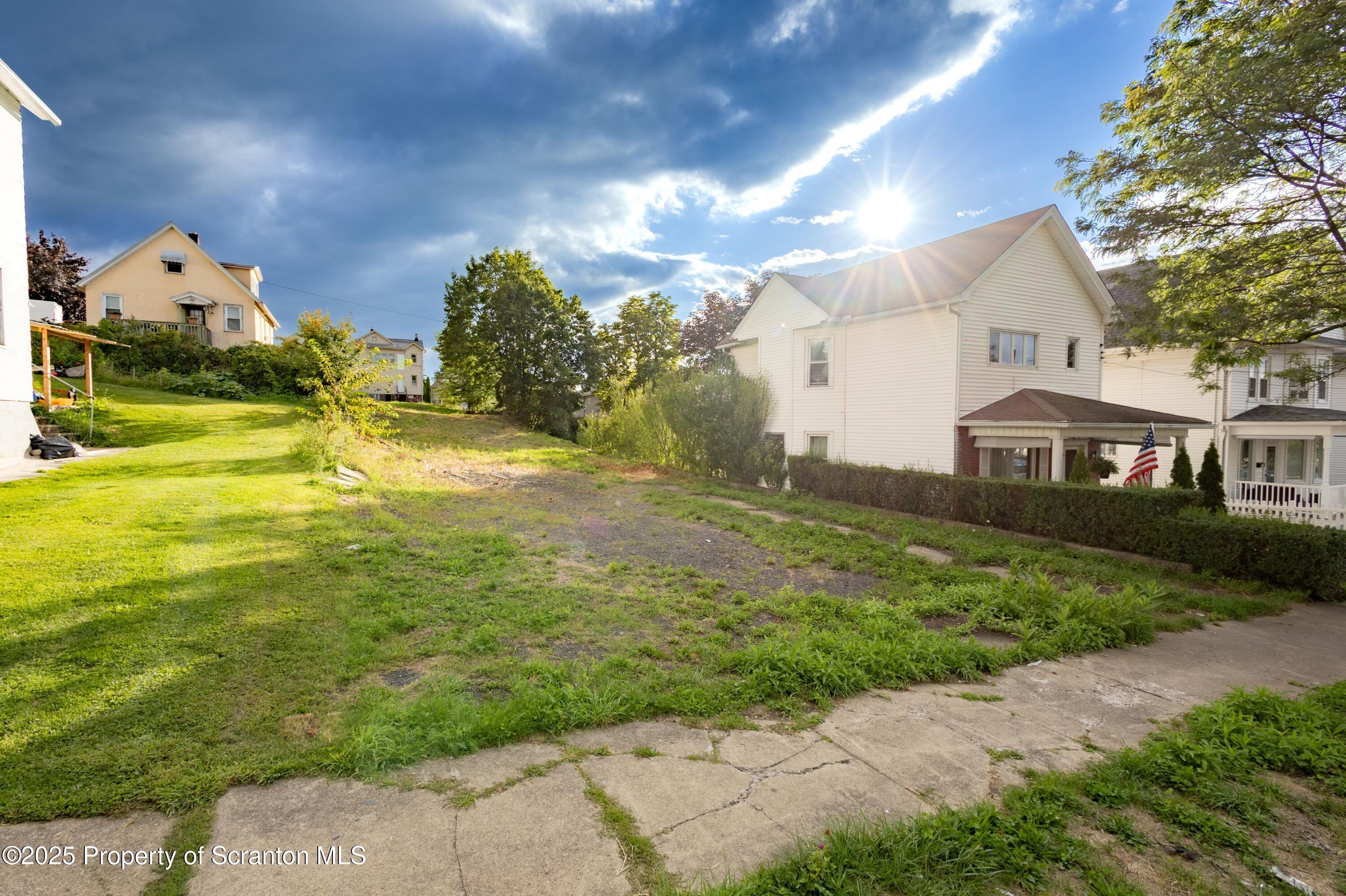 728 Alder Street Scranton, PA 18505 - Photo 2 of 13 a front view of a house with garden