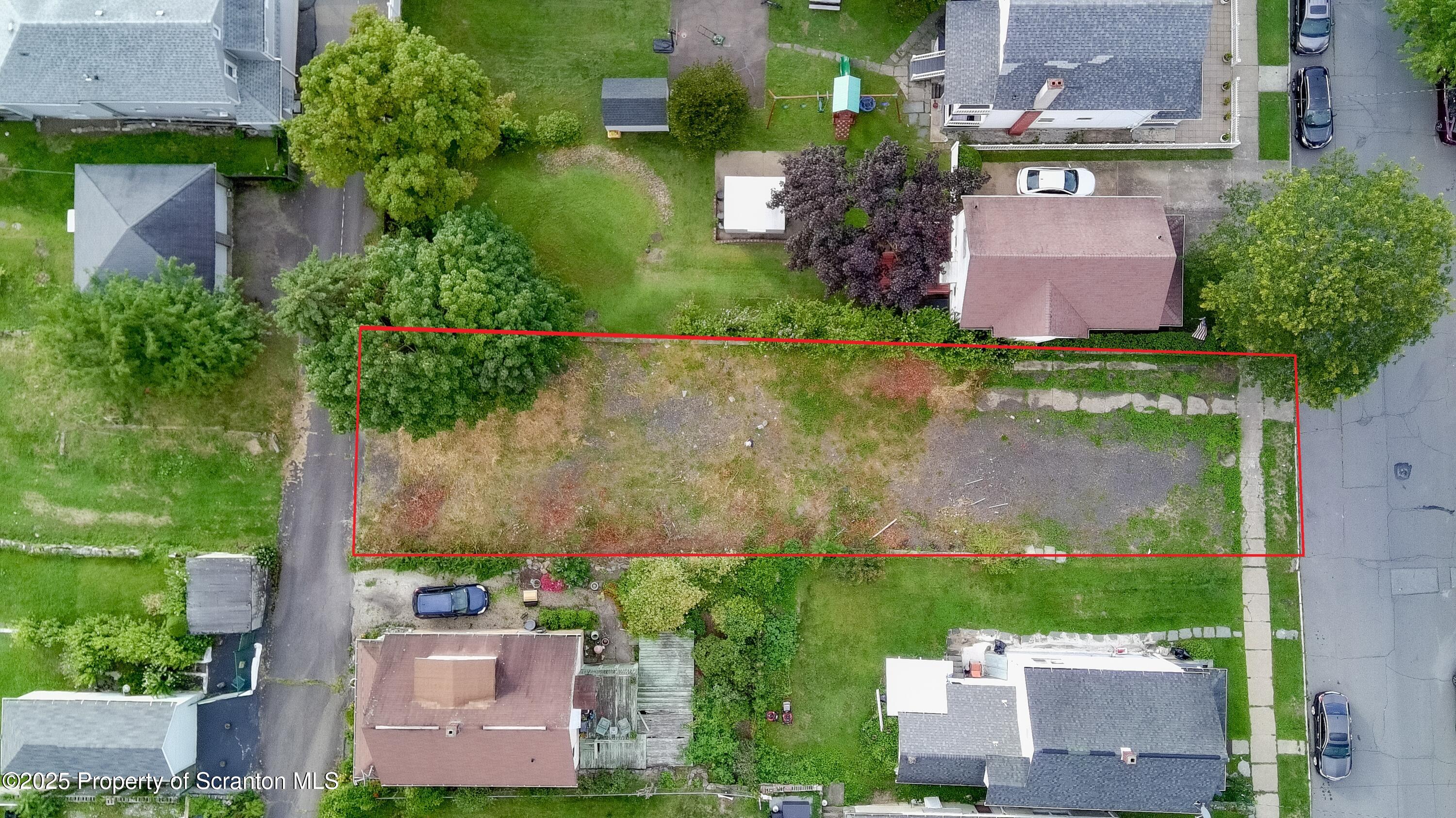 728 Alder Street Scranton, PA 18505 - Photo 6 of 13 an aerial view of a house with a garden and yard