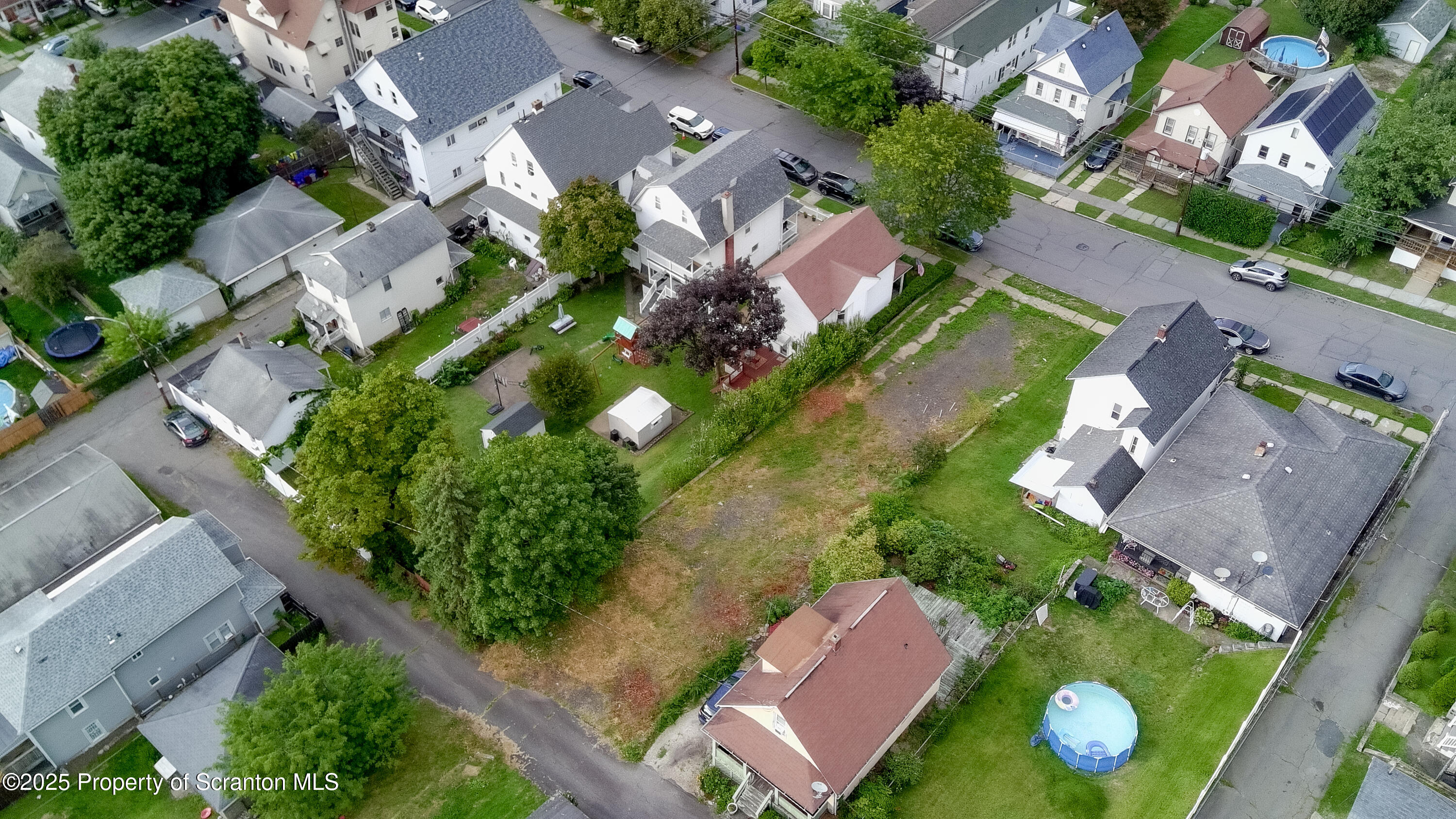 728 Alder Street Scranton, PA 18505 - Photo 8 of 13 an aerial view of residential houses with outdoor space