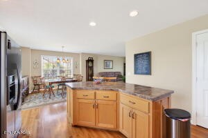 338 Pistole Road Sparta, TN 38583 - Photo 8 of 39 a kitchen with kitchen island granite countertop a sink and wooden floors