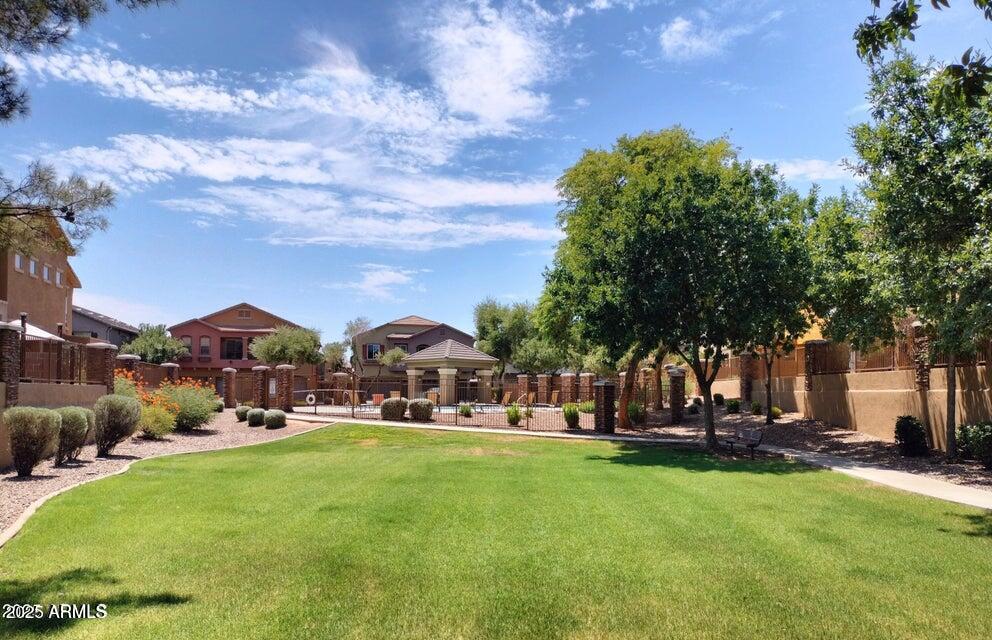 2024 South Baldwin, Unit 52 Mesa, AZ 85209 - Photo 1 of 8 a view of yard with swimming pool and green space