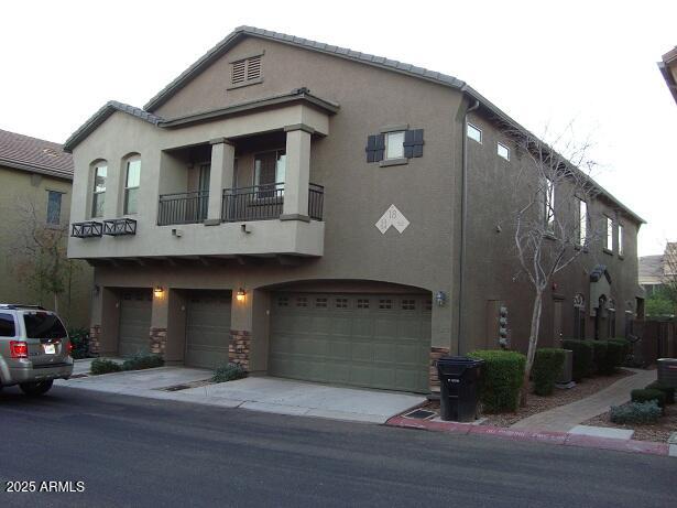 2024 South Baldwin, Unit 52 Mesa, AZ 85209 - Photo 3 of 8 a front view of a house with garden