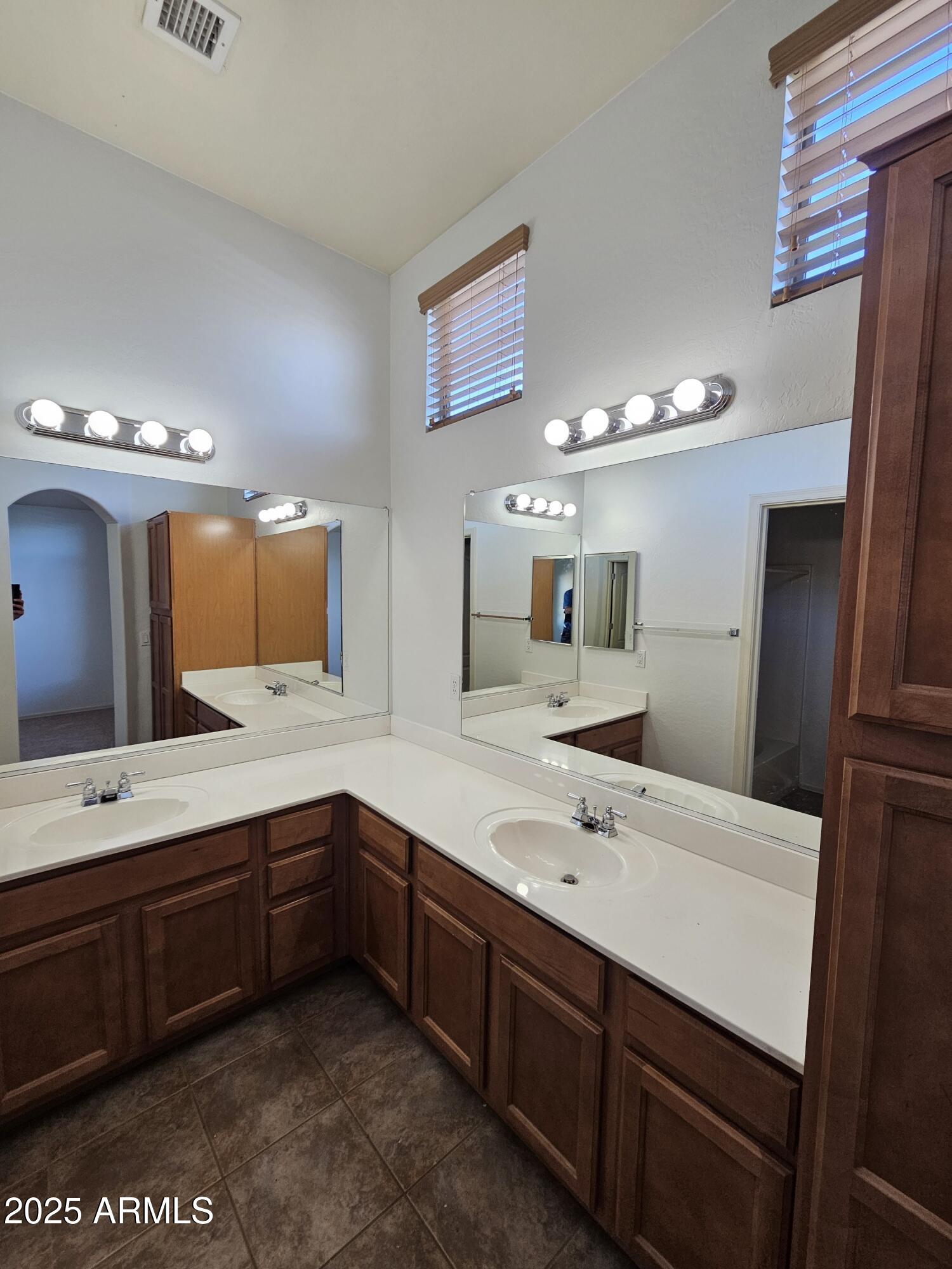 2024 South Baldwin, Unit 52 Mesa, AZ 85209 - Photo 6 of 8 a bathroom with a sink double vanity and a mirror